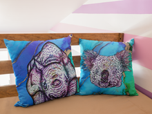 Load image into Gallery viewer, Baby rhino and koala cushions on bright blue and gold backgrounds