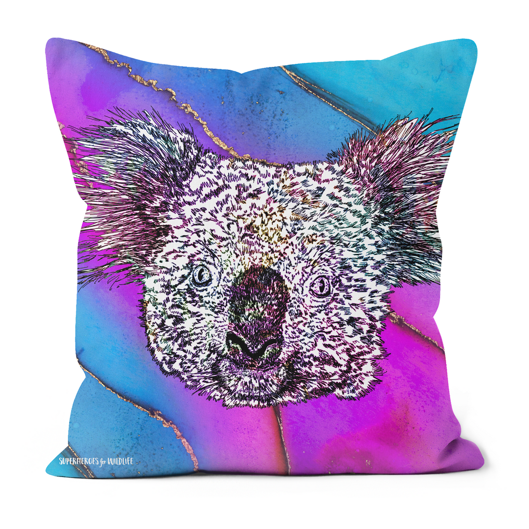 A sweet koala on a blue and pink cushion