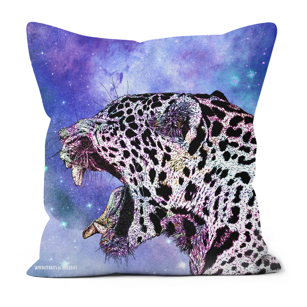 A cushion featuring a stunning jaguar on a purple galaxy inspired background