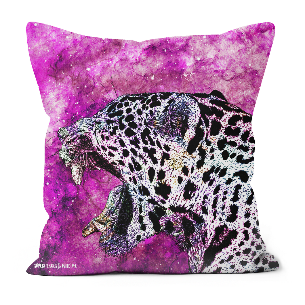 A cushion with a hand drawn jaguar on a bright pink inspired galaxy background